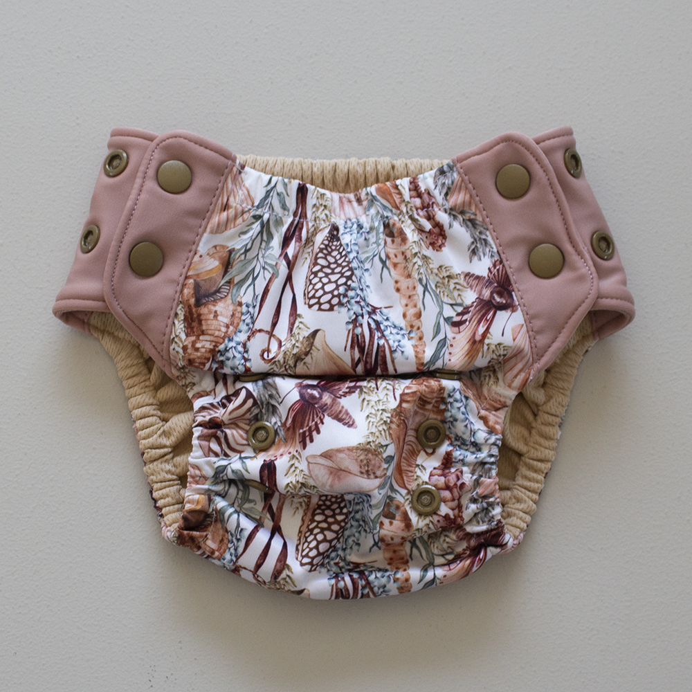 Kekoa flexible stretch wing swim nappy in Cove print. From 4-19kg (9lbs - 42lbs) in a one size OSFM design.