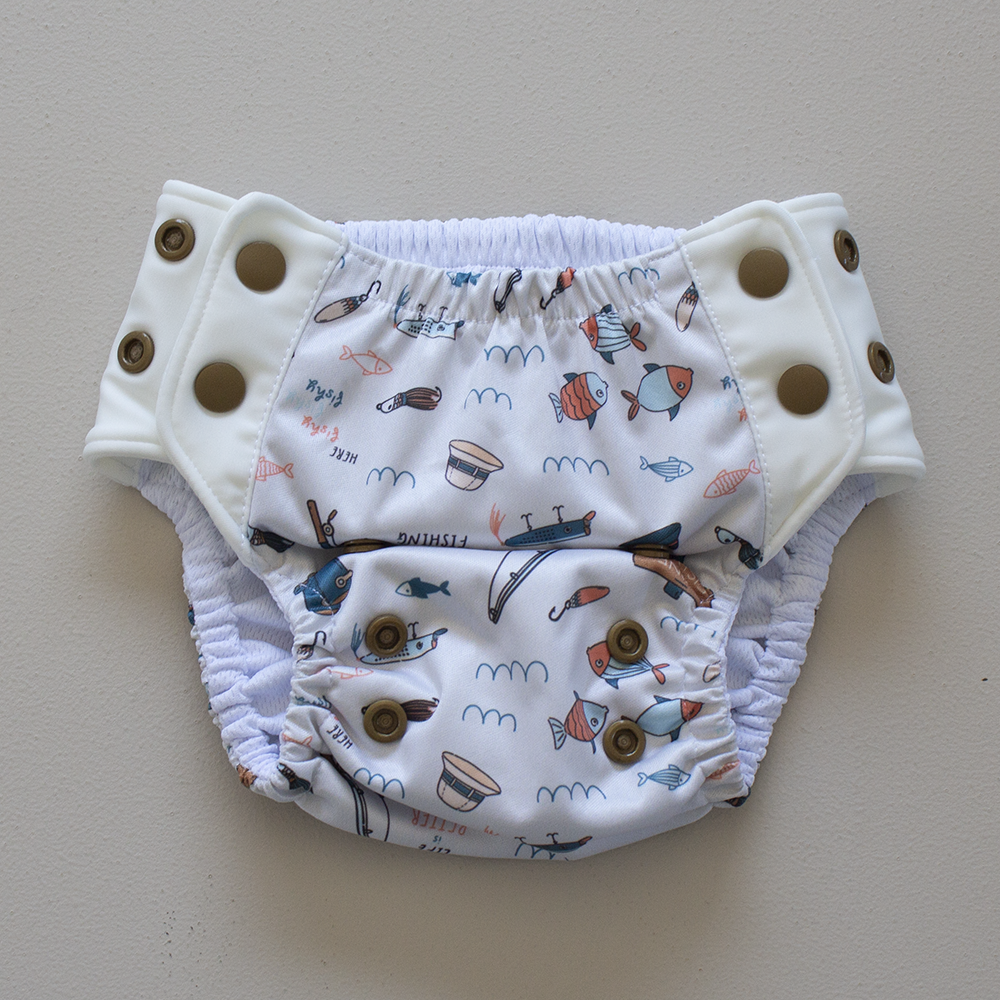 Kekoa flexible stretch wing swim nappy in Gone Fishin' (fishing) print. From 4-19kg (9lbs - 42lbs) in a one size OSFM design.