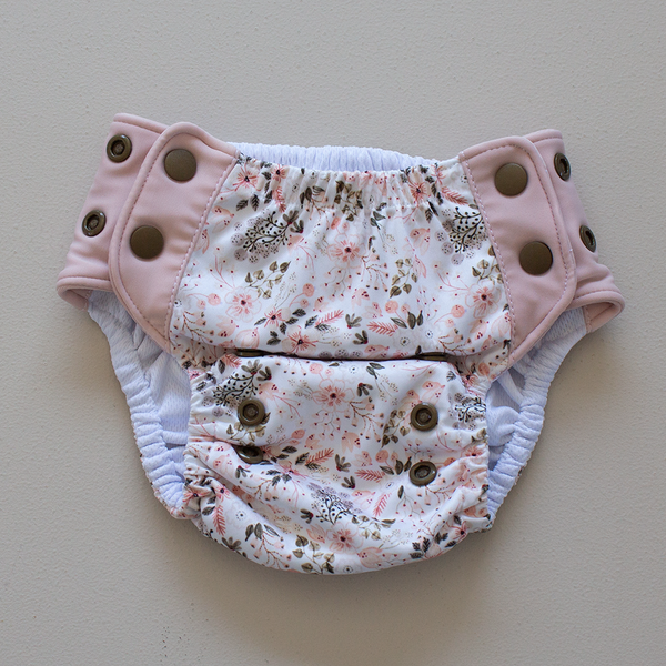 Kekoa flexible stretch wing swim nappy in Wild Meadow print. From 4-19kg (9lbs - 42lbs) in a one size OSFM design. 