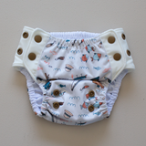 Kekoa flexible stretch wing swim nappy in Gone Fishin' (fishing) print. From 4-19kg (9lbs - 42lbs) in a one size OSFM design. 